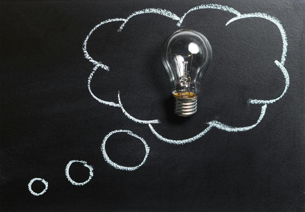 A lightbulb inside a cloud-shaped idea bubble